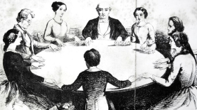 Nineteenth-century table turning session Nineteenth-century table turning session