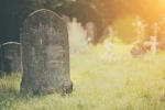 photograph of old gravestone in churchyard